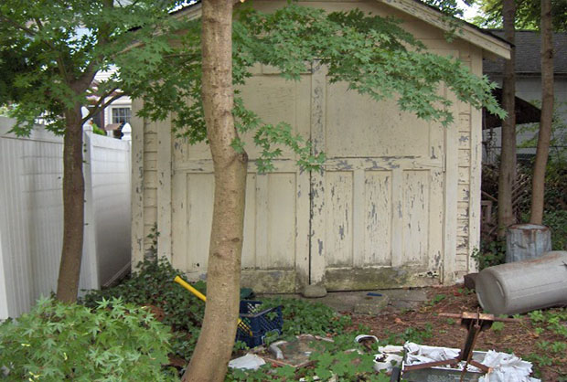peeling left side of house with shed